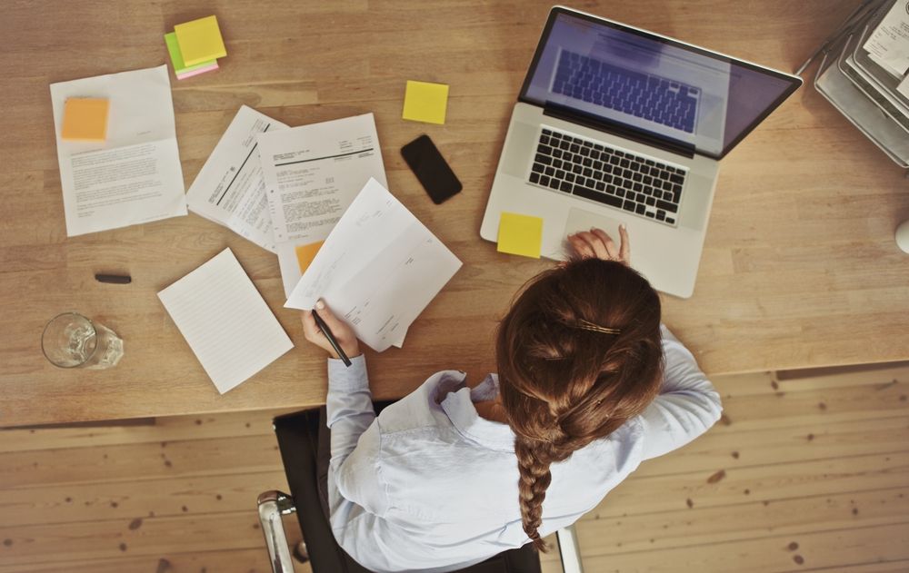 woman sitting at a desk working